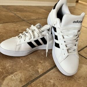 White and black Adidas sneakers